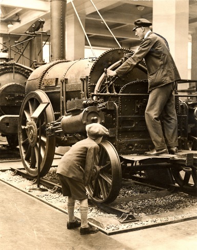 Schoolboy inspects the Rocket locomotive, 1929