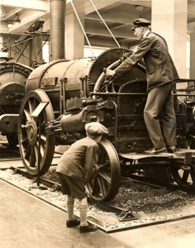 Schoolboy inspects the Rocket locomotive, 1929